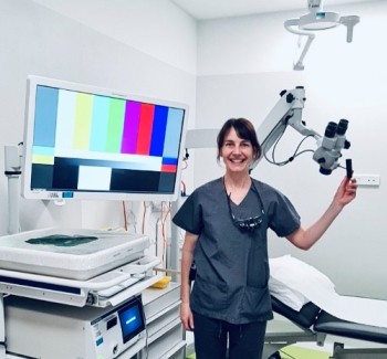 Medical ENT surgeon with new paediatric surgical microscope 