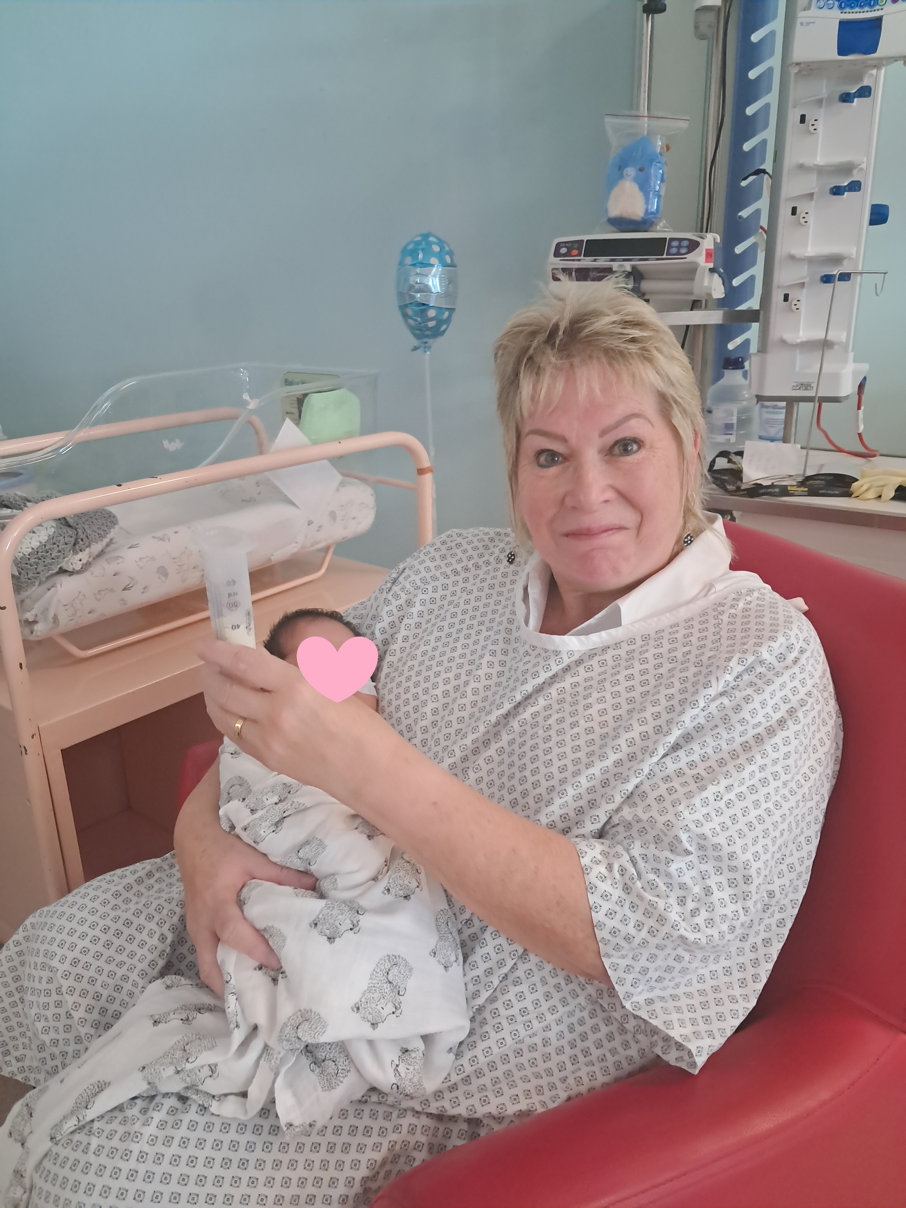 Jo a NICU Cuddle Buddy holding a baby