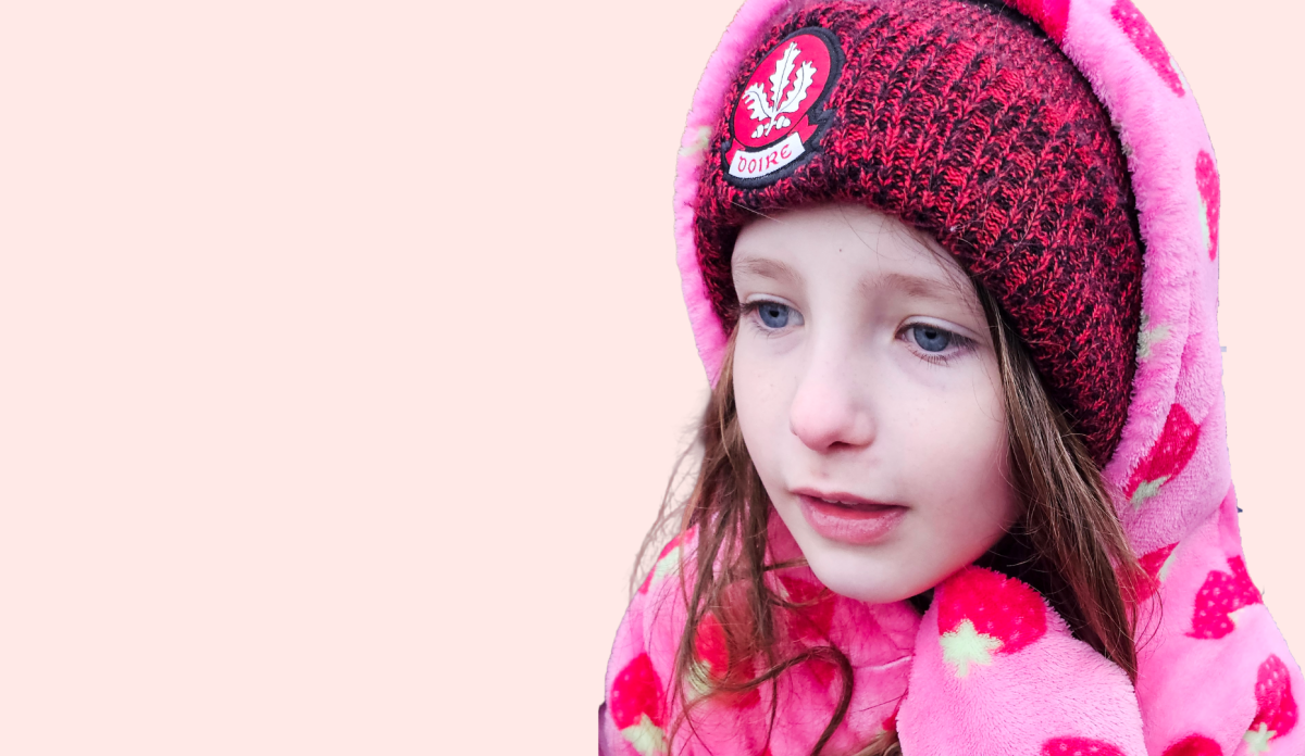 Grace, nine years, wearing a pink hoodie