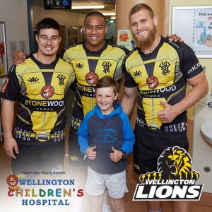 Some of the players wearing the Wellington Lions Charity Rugby shirt design, featuring Hospi. 